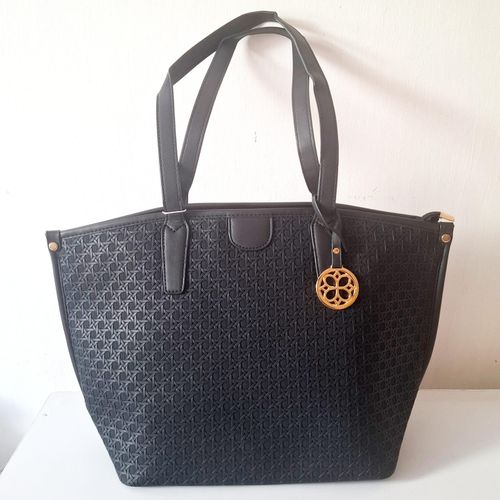 Ladies' large black tote handbag with gold pendant and textured exterior