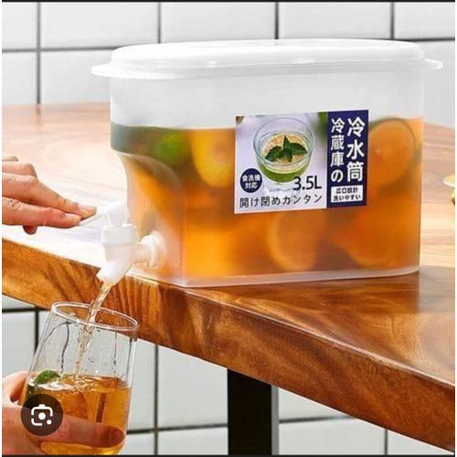 Table top or fridge container with dispenser tap