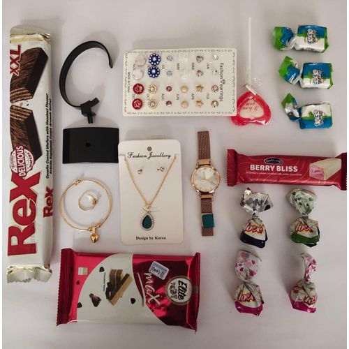 Womens Day gift 25 pcs package 1 classy watch 1 acrylic stand 13 pairs of earings 1 goldtone chain with pendant 1 goldtone bango with ring 1 dairyland chocolate 1 Rex hazelnut wafer 1 EliteMax Chocolate wafer 8 chocolate balls