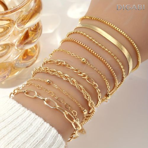 A Set Of 10 Pieces Of Womens Stackable Bracelets Featuring A Simple And Classic Twisted Snake Chain Design Suitable For Daily Wear Or As A Gift For Holidays