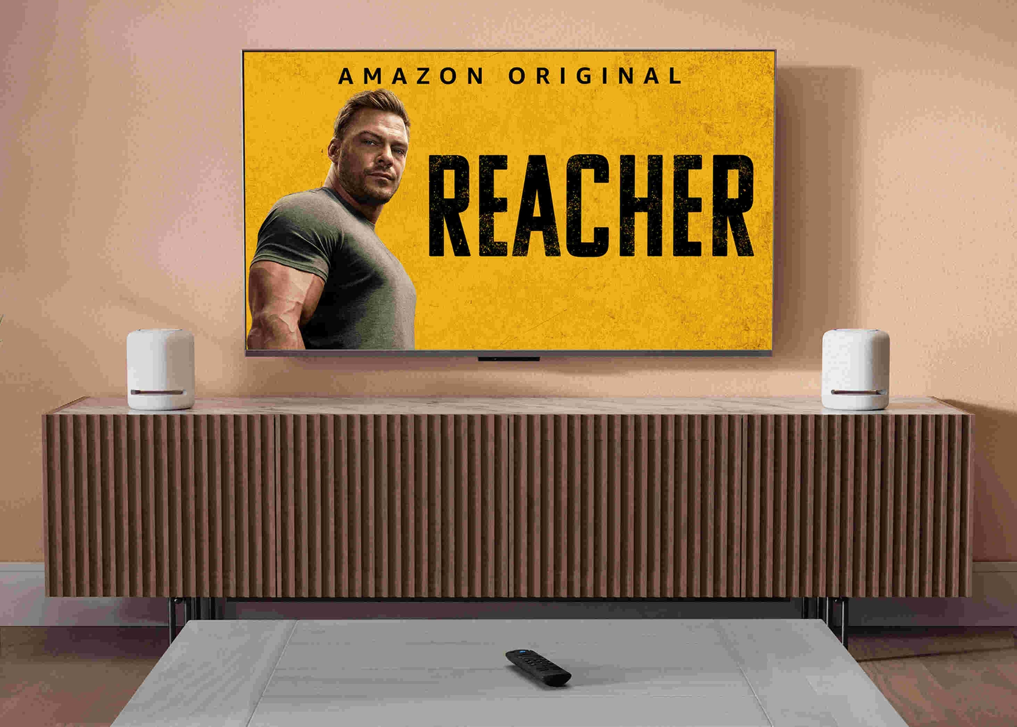 HDTV mounted on a wall in a modern living room showing Prime Video's