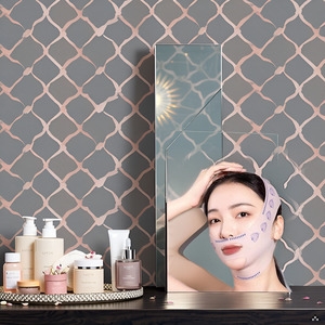 A serene spa setting with a product displayed on a wooden surface surrounded by bamboo stems and peb