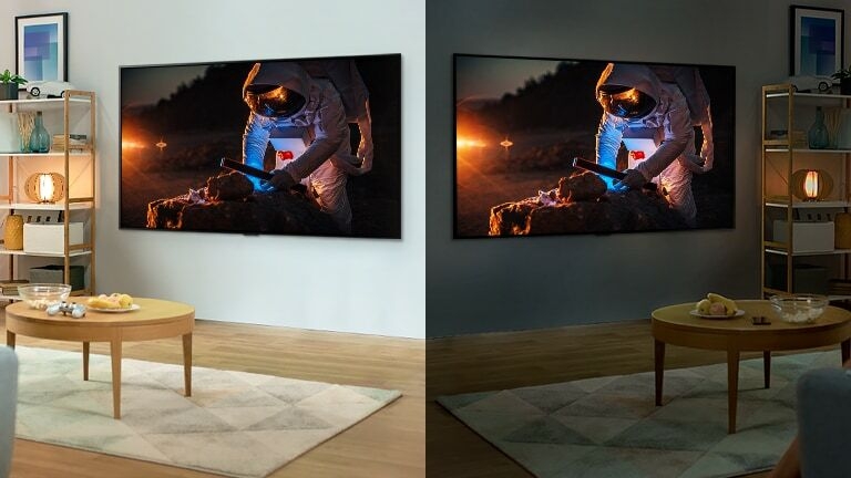 A television showing an astronaut is in a bright room.  On the right there is a television in a dark room, on which the astronaut is displayed brighter.