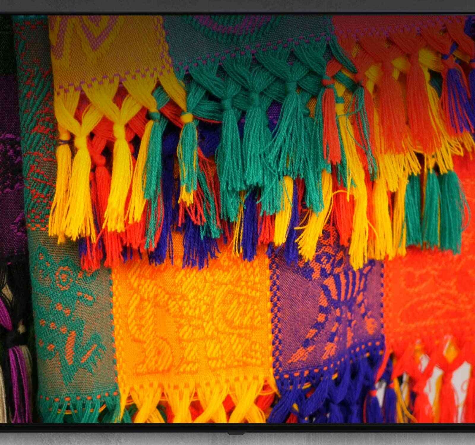 A TV carries out commands spoken while pressing a button on a remote control, such as