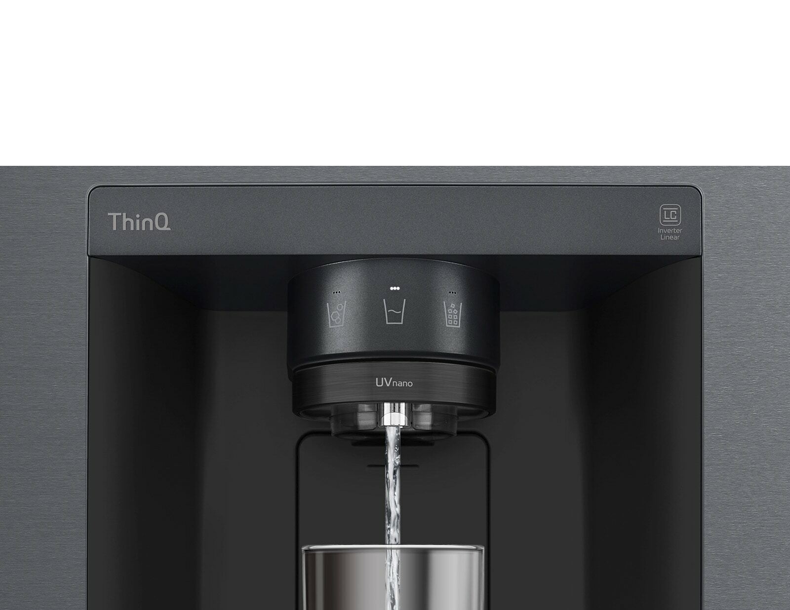 A video starts zoomed in on the water dispenser. The exterior of the refrigerator goes clear and now the interior of the door and mechanical parts of the dispenser nozzle can be seen. The video zooms in further to show the water droplets as they fall through the UVnano part of the nozzle which reduces the bacteria. The view zooms back out to see the exterior of the refrigerator again as water is being dispensed into a glass.