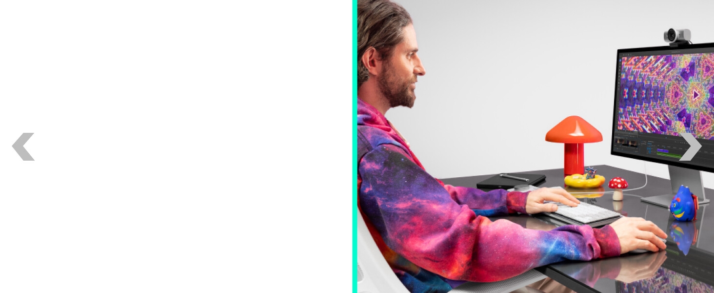 a person working on a computer typing on mx mechanical mini for mac wireless keyboard