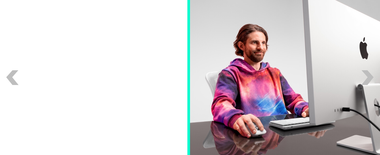 a man working on a computer using mx master 4 for mac ergonomic wireless mouse