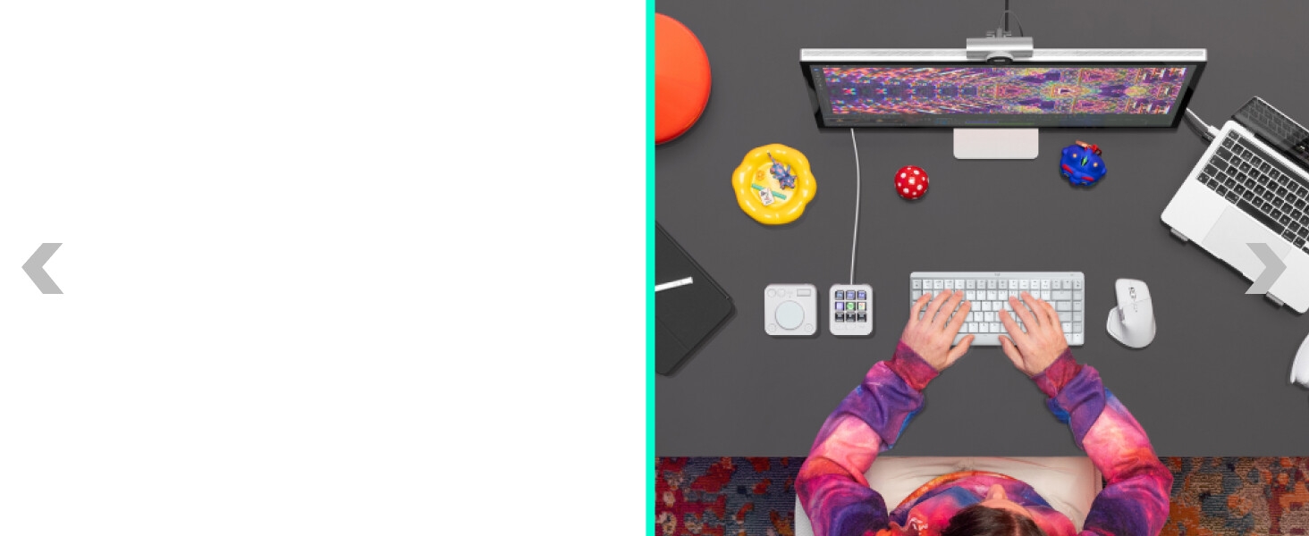 a person working on a computer typing on mx mechanical mini for mac wireless keyboard