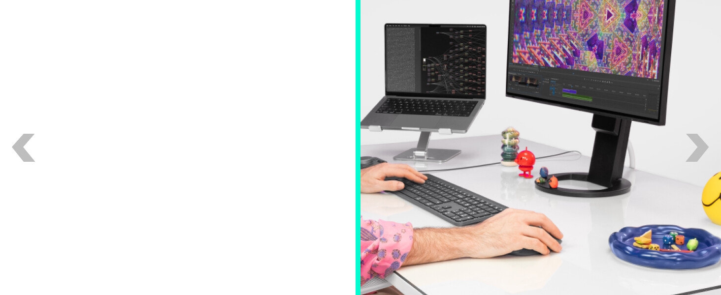 a desktop setup with a laptop, a desktop, mx keys s keyboard and master 4 ergonomic wireless mouse