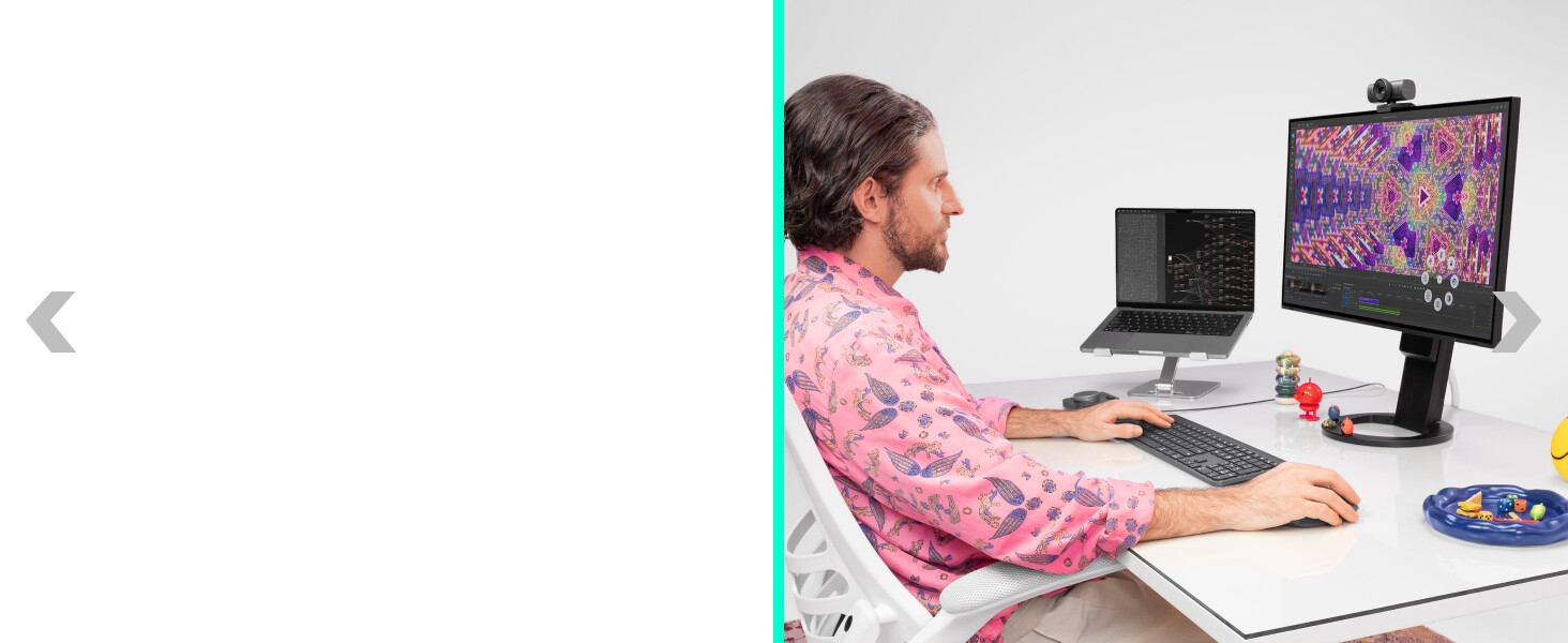 a man working on a computer using mx master 4 ergonomic wireless mouse