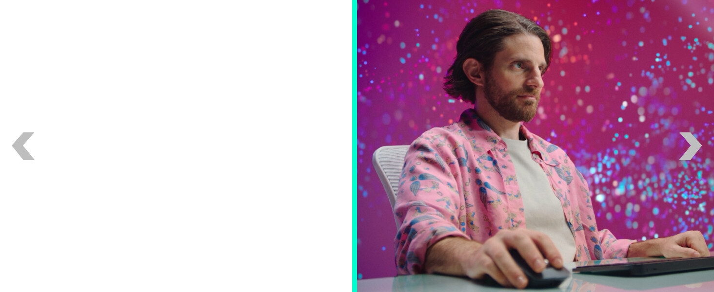 a man working on a computer using mx master 4 ergonomic wireless mouse