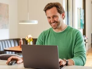 a man suing mx anywhere 3s wireless compact mouse with 8k dpi sensor and fast scrolling