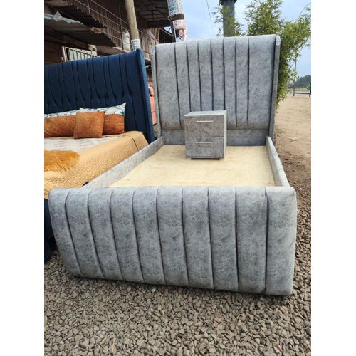 4by6 grey upholstered Chesterfield bed frame with a matching nightstand