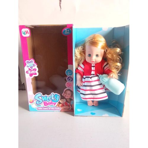 White baby doll with bottle