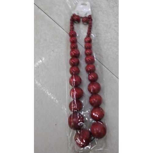 African wooden neckless earings red in colour