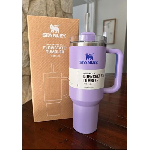 Purple 1.18L insulated tumbler with handle and lid, designed to keep drinks hot or cold for hours.