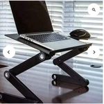 Laptop stand with mouse rest