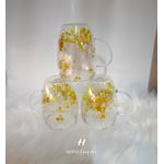 Double glass cup with flowers in the middle layer