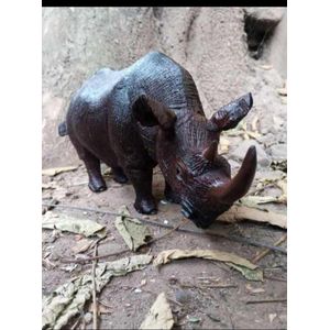 Rhino Carving ( 12 inches L, 7 inches W, 8 inches H )- With its alluring ebony hue and intricate details, this carving adds an element of cultural significance and natural beauty to any room