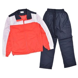 Tracksuit in a red, white, and navy blue color block design in sizes Small to 2 XL
