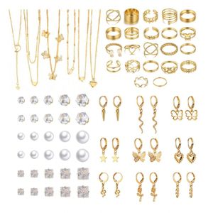 Vintage alloy butterfly pearl earrings, necklace, and ring set.