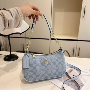 Gemini said Coach Signature Monogram Baguette