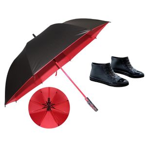 Red Umbrella and black female gumboots 