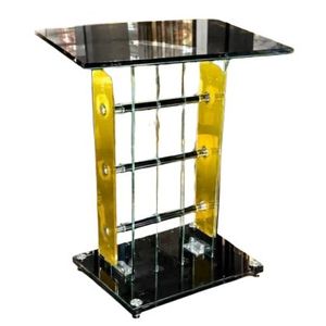 A modern tempered glass and acrylic church pulpit or podium stand featuring a black glass top and base with yellow side panels. 