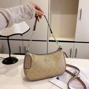 Gemini said Coach Signature Monogram Mini Bag