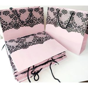 Pink lace print gift bags with a glossy finish 